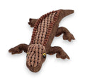 Brown fabric crocodile toy with textured scales and yellow eyes