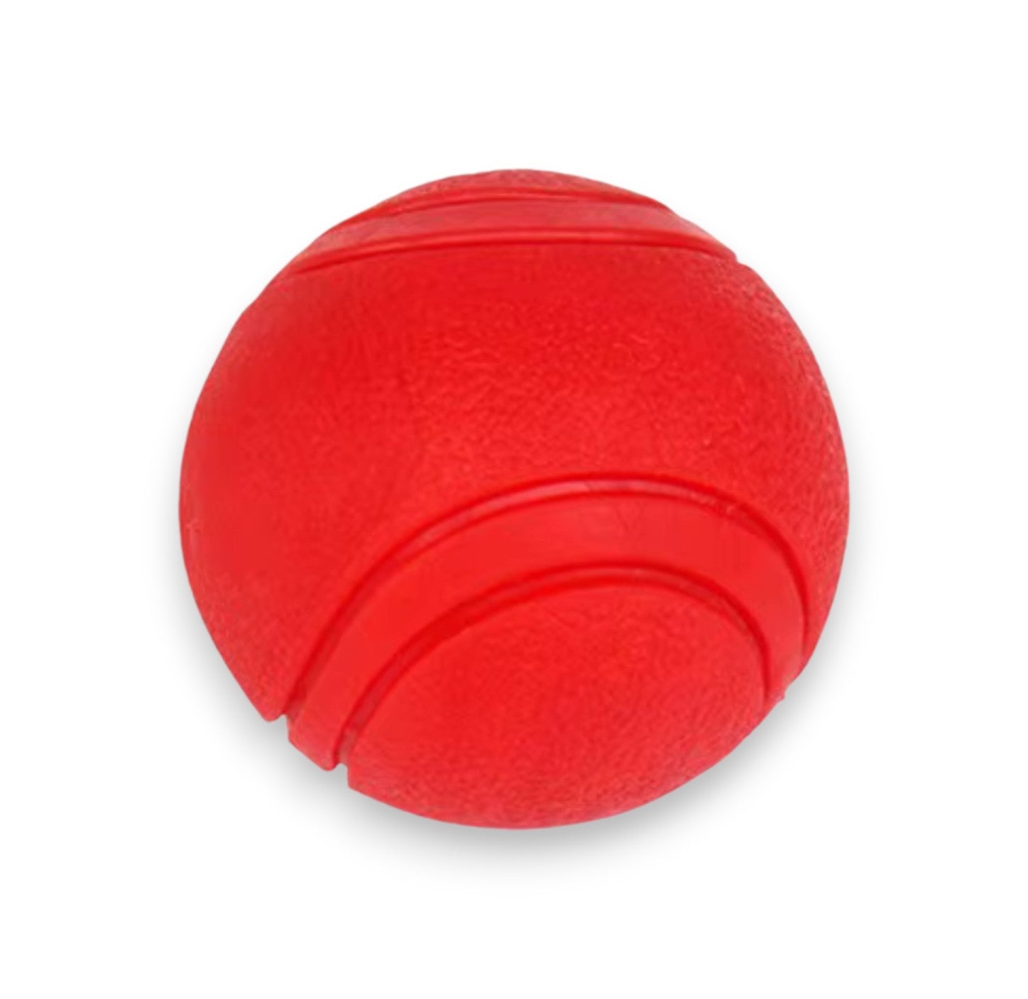 A red textured rubber dog ball with two molded lines.
