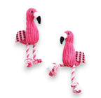 Two pink corduroy flamingo dog toys with rope legs and checkered wings.