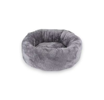 Round gray plush dog bed with high cushioned sides.