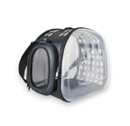 Black pet carrier bag with clear dome window featuring a paw print and white polka dots, plus a mesh side window.